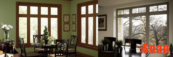A residential dining room has casement windows with wood frames.