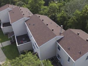 New asphalt shingles roofing in an apartment complex.
