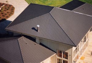 Aerial view of a home with a metal roof.