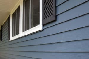 Close up of side of a house with siding and window