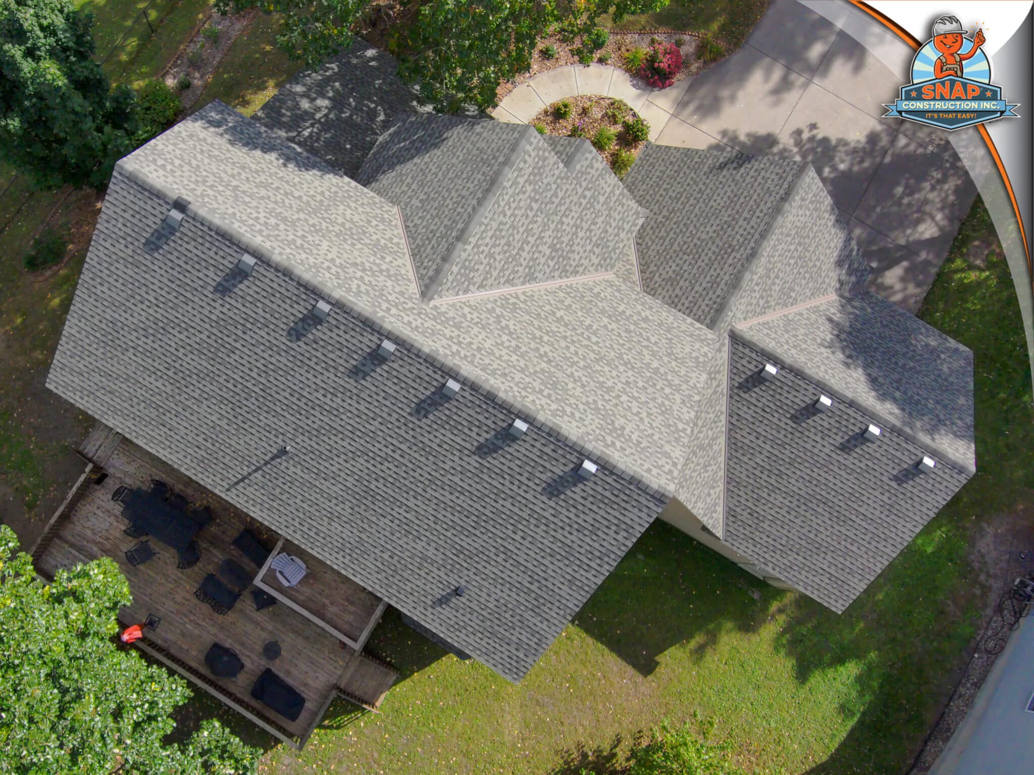 Aerial view of a home with gray asphalt shingles and roof vents, showcasing Snap Construction roofing estimates in Bloomington MN